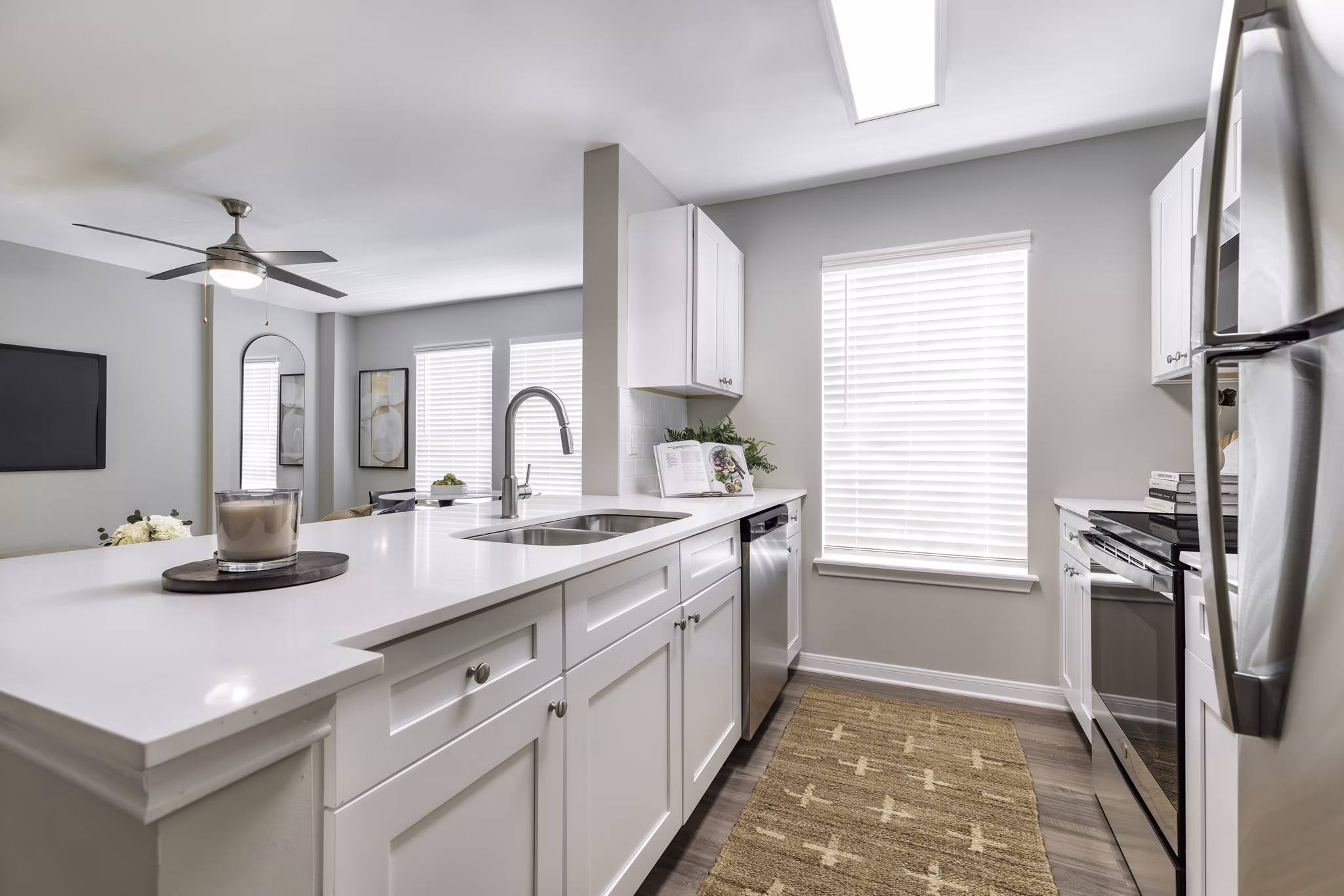 Modern kitchen featuring stainless steel appliances at Oltera in SoEast Apartments, perfect for luxury living in a vibrant community