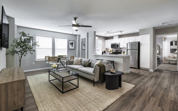 Spacious living room with contemporary design elements at Oltera in SoEast Apartments