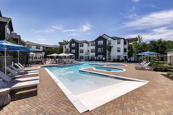 Luxurious outdoor pool at Oltera in SoEast Apartments, offering a relaxing space with modern design for residents to enjoy