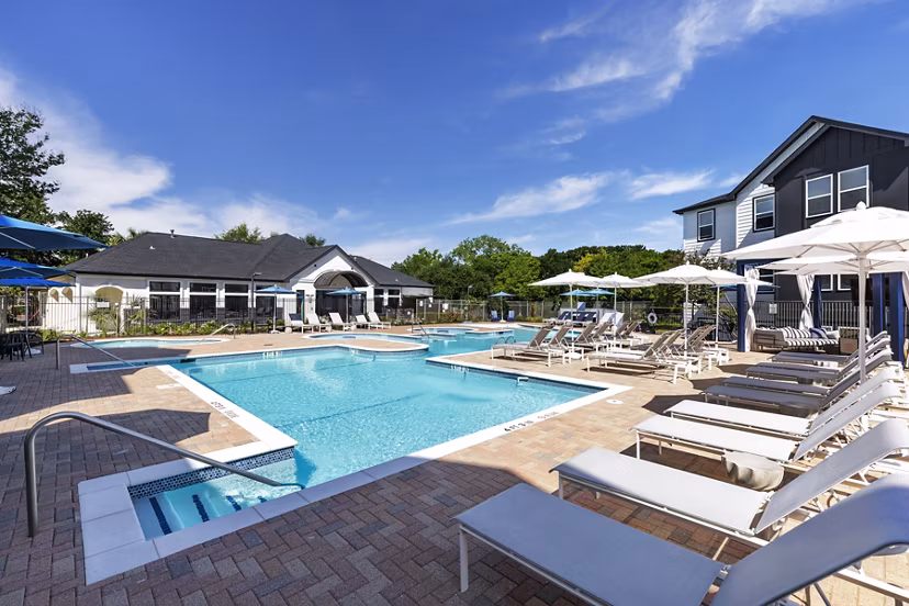 Relax by the expansive pool at Oltera in SoEast Apartments, offering luxury amenities and a serene setting