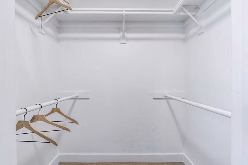 Spacious bedroom closet with organized shelving at Desert Shadows Apartments, offering luxury and convenience for modern living