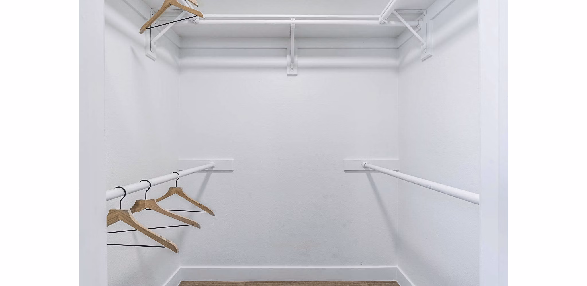 Spacious bedroom closet with organized shelving at Desert Shadows Apartments, offering luxury and convenience for modern living