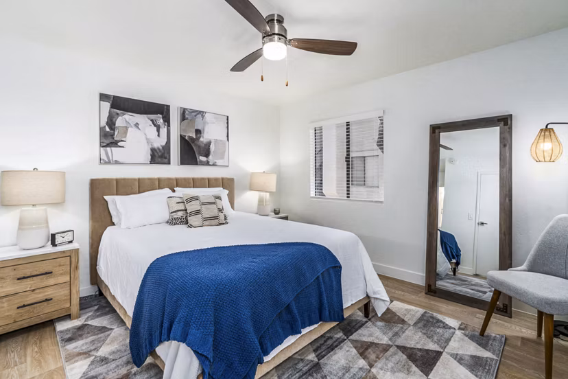 Bedroom with stylish dÃ©cor and ample natural light at Desert Shadows Apartments