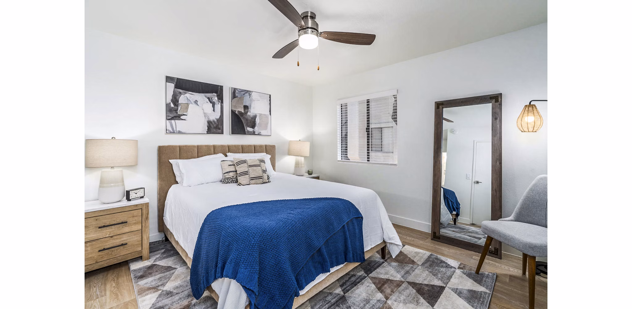 Bedroom with stylish dÃ©cor and ample natural light at Desert Shadows Apartments