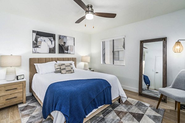 Bedroom with stylish dÃ©cor and ample natural light at Desert Shadows Apartments