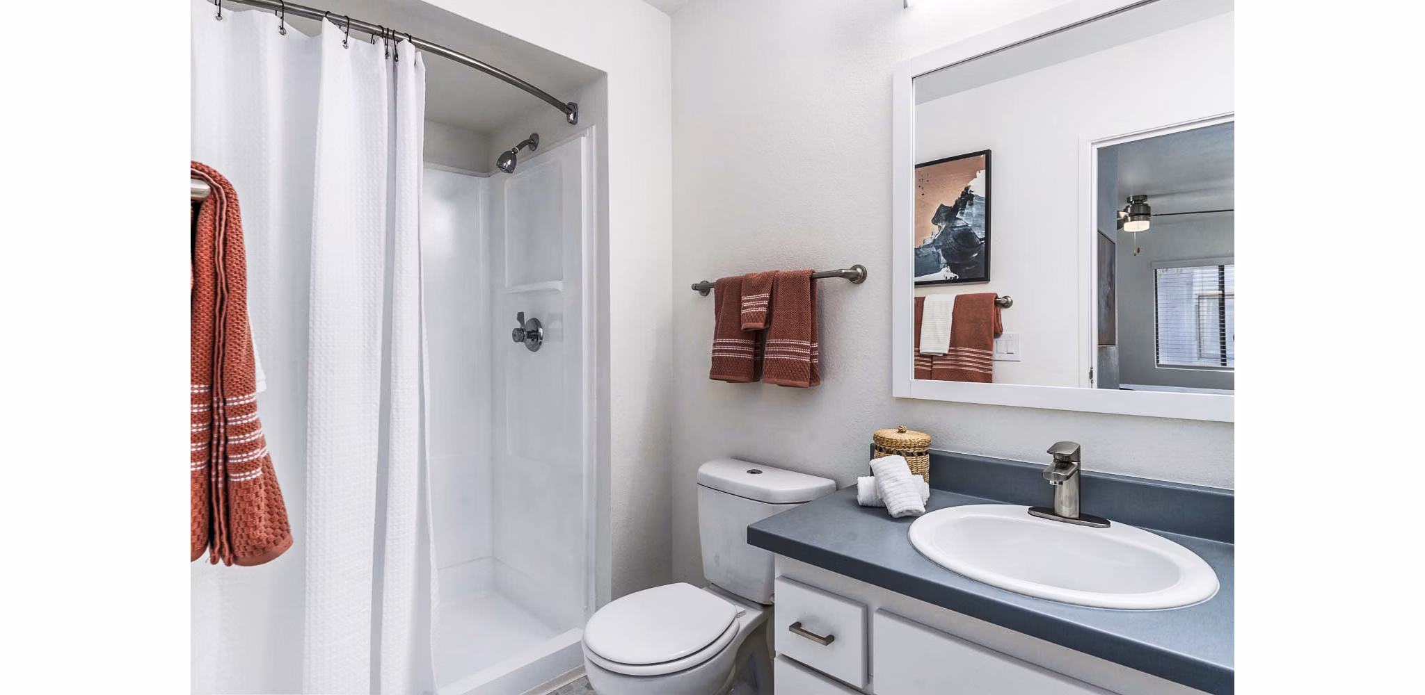 Bathroom at Desert Shadows Apartments featuring sleek fixtures and granite countertops, offering luxury living in a Greystar-managed community