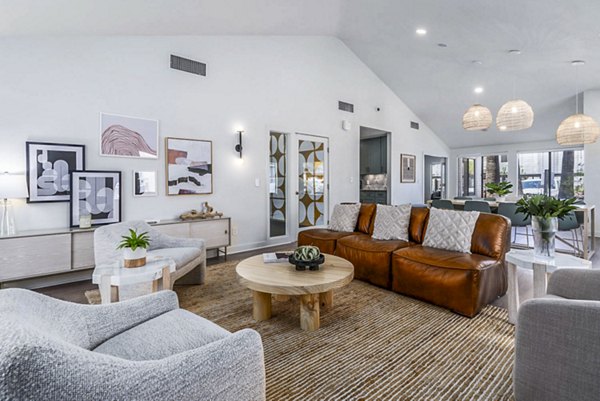 Clubhouse lounge with stylish seating area and modern decor at Sparro Apartments