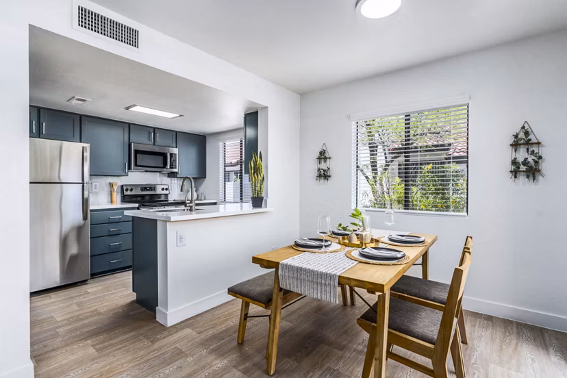 Dining room featuring elegant lighting and modern decor in Desert Shadows Apartments