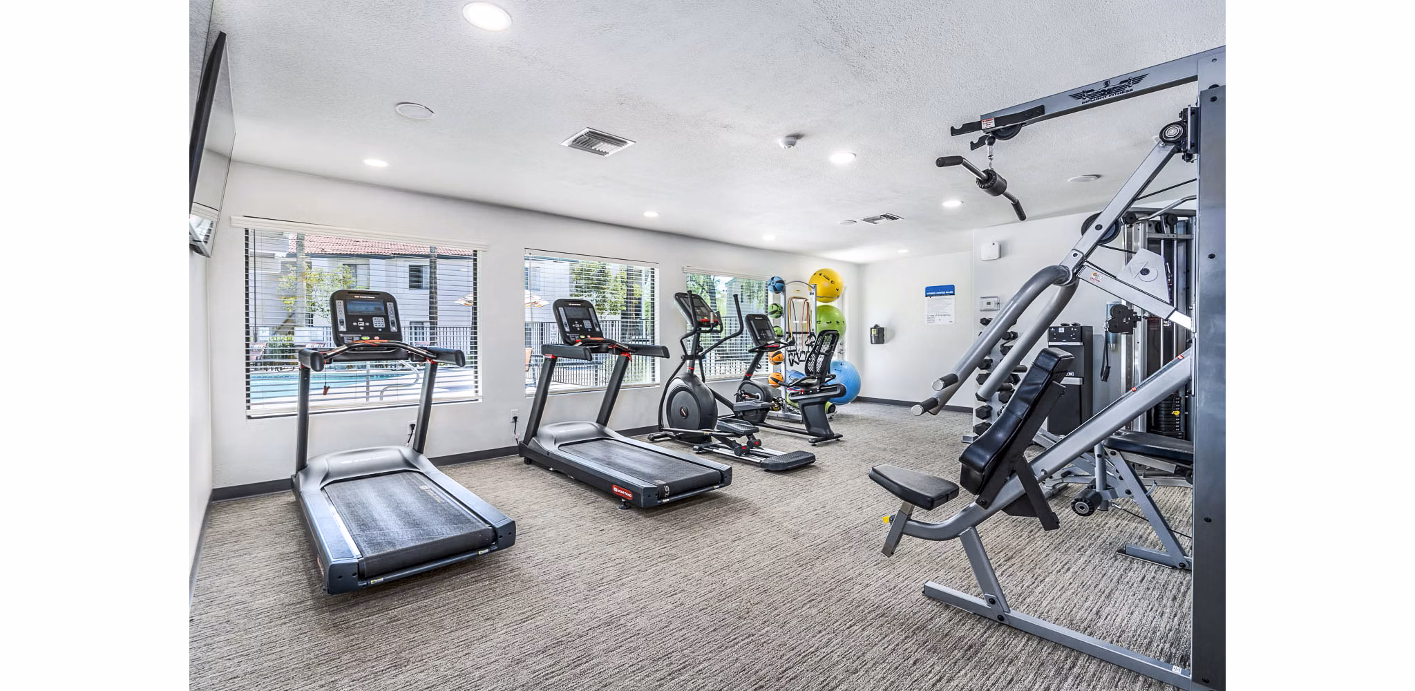 Modern fitness center with state-of-the-art equipment at Desert Shadows Apartments luxury community