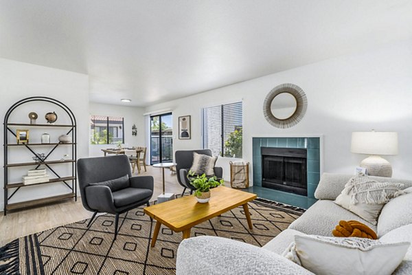 Sunlit living room with modern furnishings at Desert Shadows Apartments, a Greystar luxury community