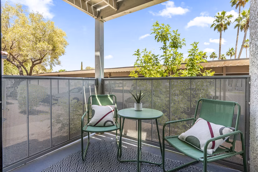 Outdoor patio with stylish seating at Desert Shadows Apartments, an upscale living community