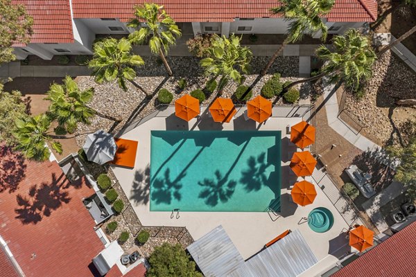 Resort-style pool with sun loungers at Sparro Midtown Apartments