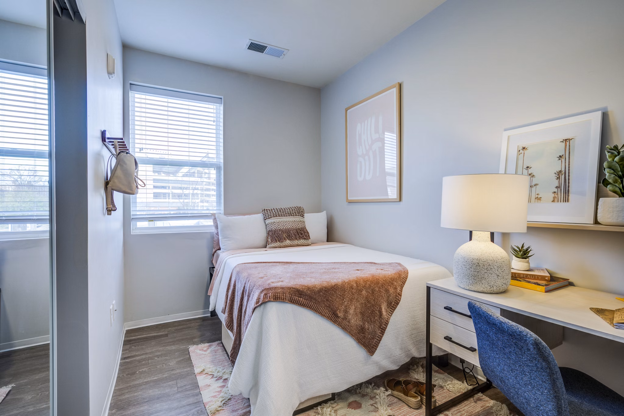 Cozy bedroom with neutral tones and modern furnishings in Union Tuscaloosa Apartments