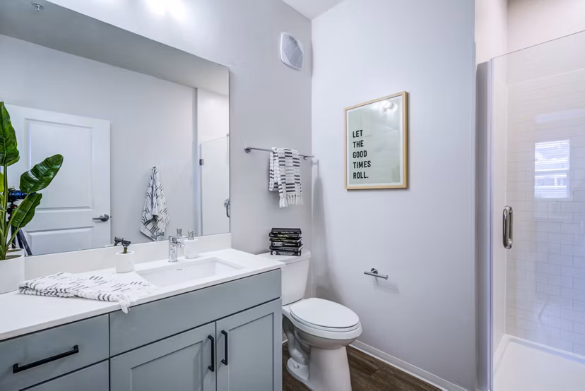 Modern bathroom featuring granite countertops and sleek fixtures at Union Tuscaloosa Apartments, offering luxury living spaces
