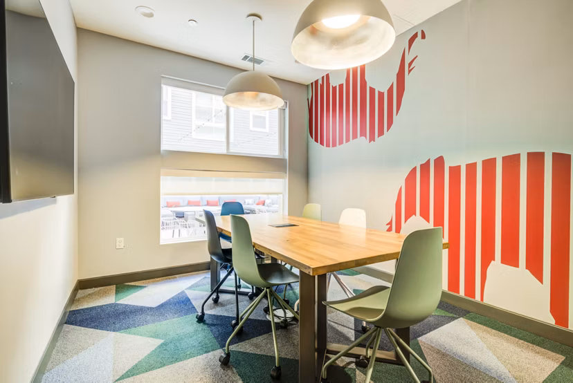 Meeting room with modern decor in Union Tuscaloosa Apartments clubhouse