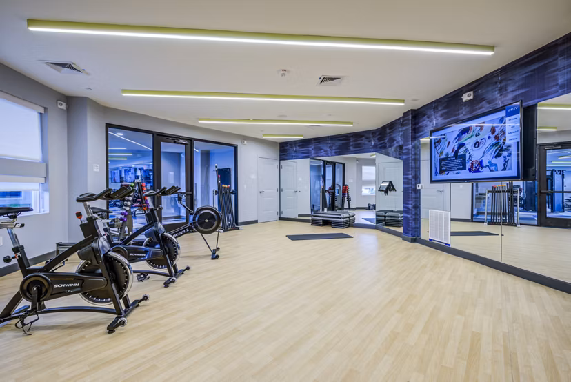 State-of-the-art fitness center with modern equipment at Union Tuscaloosa Apartments, offering premium workout facilities