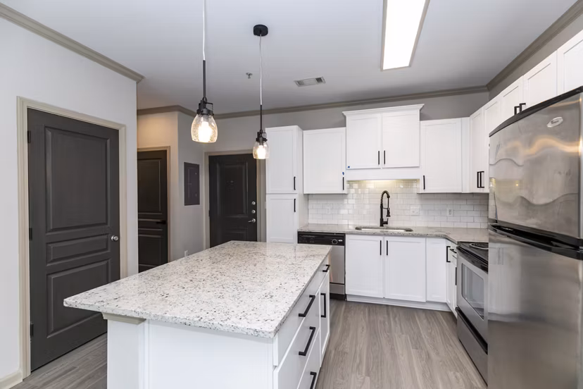 Modern kitchen with stainless steel appliances in Westmount Ashwood Apartments