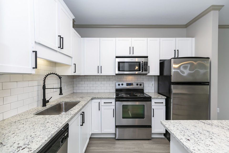 Modern kitchen with stainless steel appliances in Westmount Ashwood Apartments