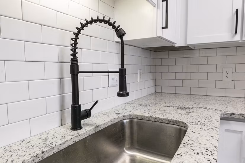 Modern kitchen with sleek appliances at Westmount Ashwood Apartments