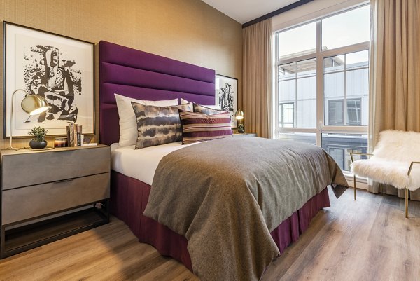 Cozy bedroom with modern decor at Arista Apartments