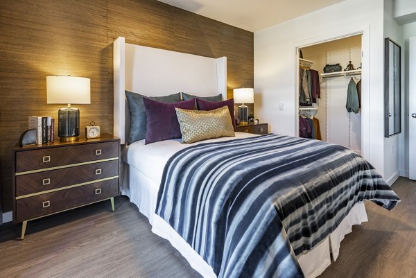 Cozy bedroom with elegant decor at Arista Apartments