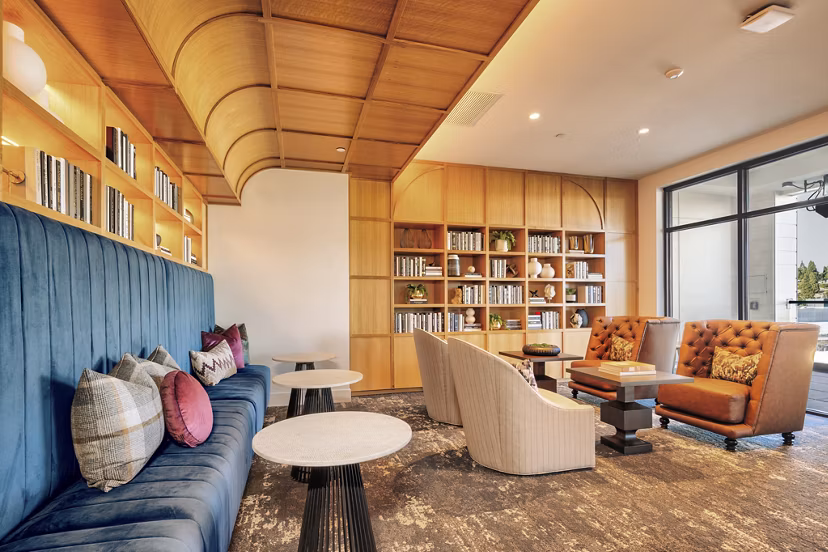 Clubhouse with modern decor and seating area at Arista Apartments