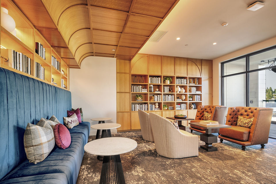 Clubhouse with modern decor and seating area at Arista Apartments