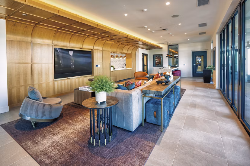 Luxurious clubhouse featuring modern design at Arista Apartments, perfect for social gatherings and community events