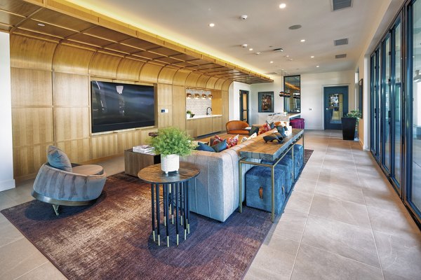 Luxurious clubhouse featuring modern design at Arista Apartments, perfect for social gatherings and community events