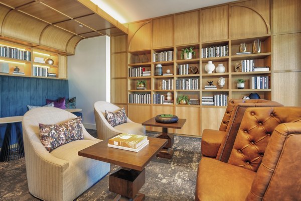Luxurious clubhouse with modern design at Arista Apartments featuring stylish seating and entertainment areas