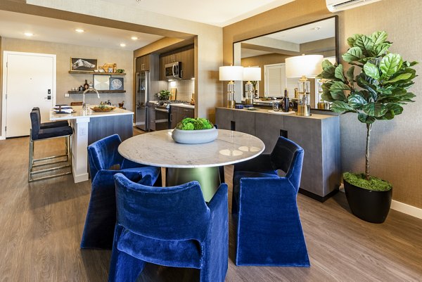Stylish dining area with modern furnishings at Arista Apartments, perfect for luxury living