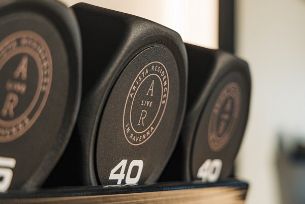 Modern fitness center with state-of-the-art equipment at Arista Apartments
