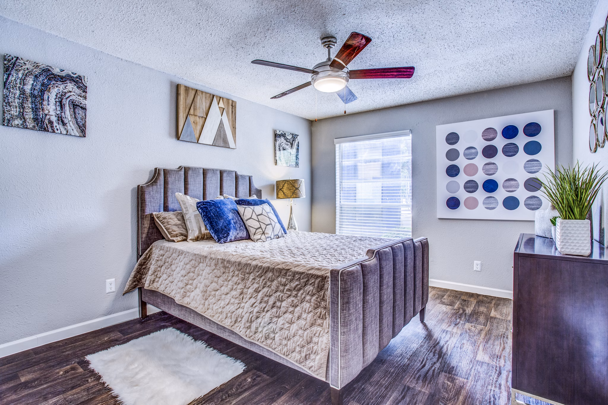 Elegant bedroom with modern furnishings at The Oakley Apartments, offering a luxurious living experience in a premier location