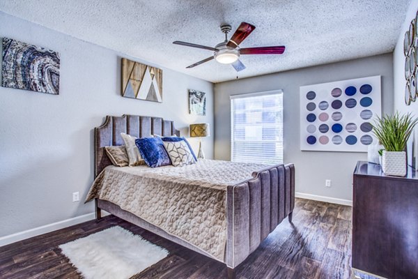 Elegant bedroom with modern furnishings at The Oakley Apartments, offering a luxurious living experience in a premier location