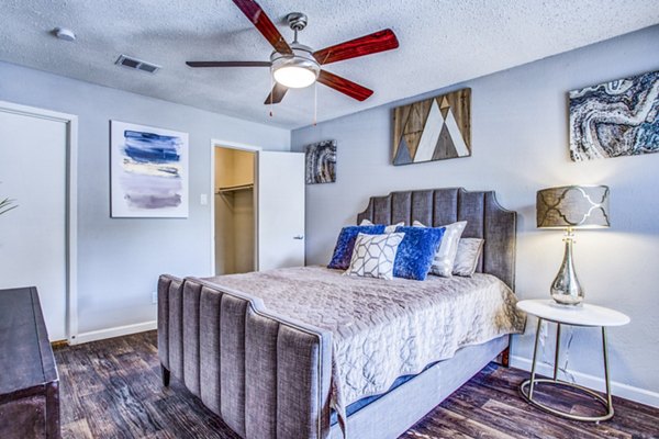 Elegant bedroom with modern furnishings at The Oakley Apartments