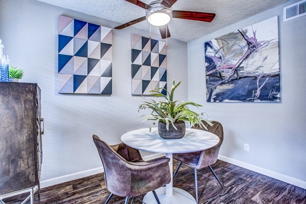 Dining room featuring elegant dining set and modern lighting fixtures at The Oakley Apartments, a Greystar luxury apartment community