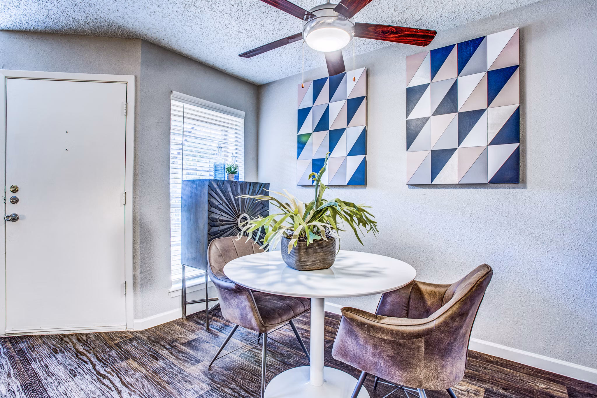 Elegant dining room with stylish decor at The Oakley Apartments, ideal for hosting dinners and gatherings in a luxury setting