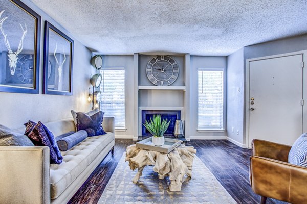 Modern living room with stylish furnishings at The Oakley Apartments in Arlington, TX.