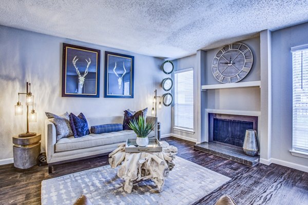Spacious living room with contemporary furnishings in The Oakley Apartments, luxury space for comfort and style