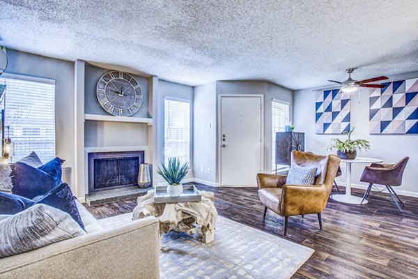 Stylish living room with modern decor at The Oakley Apartments