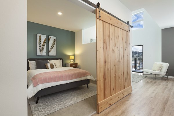 Cozy bedroom with chic decor at Spencer 68 Apartments, offering modern amenities and a comfortable living space