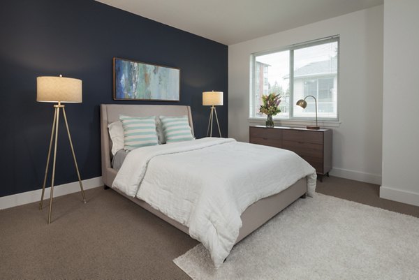 Modern bedroom with sleek design at Spencer 68 Apartments, a Greystar luxury community in Seattle