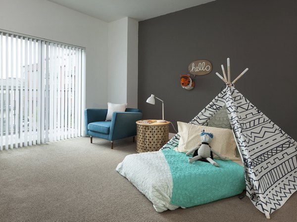 Cozy bedroom with modern decor at Spencer 68 Apartments, offering comfort and style