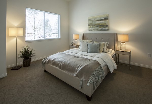 Cozy bedroom with modern decor at Spencer 68 Apartments
