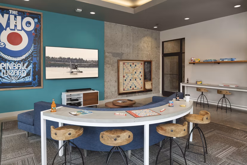 Game room featuring pool table and modern seating at Spencer 68 Apartments