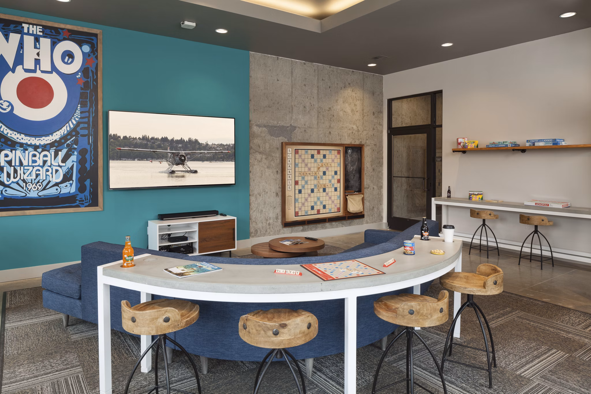 Game room featuring pool table and modern seating at Spencer 68 Apartments
