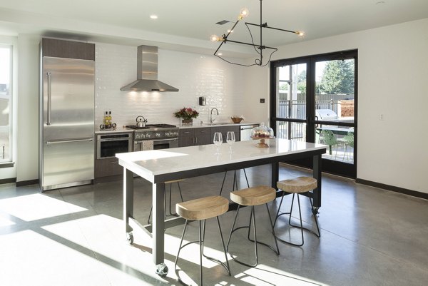 Modern clubhouse with seating and games at Spencer 68 Apartments, luxury living in Lynnwood
