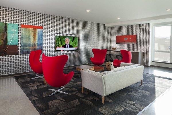 Stylish modern clubhouse with open seating at Spencer 68 Apartments