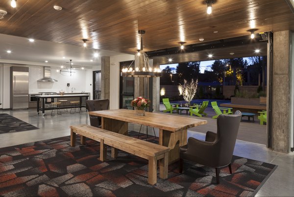 Modern clubhouse with stylish seating and vibrant dÃ©cor at Spencer 68 Apartments in a luxury apartment community