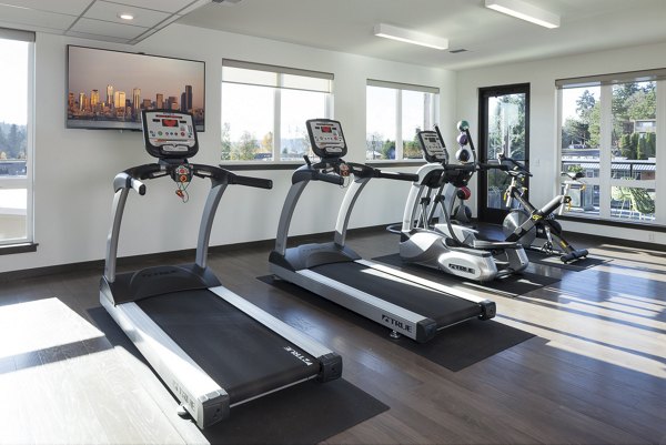 State-of-the-art fitness center at Spencer 68 Apartments, featuring modern gym equipment for residents' health and wellness